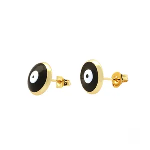Macro detail of 18K gold plated evil eye stud earrings with enamel finish