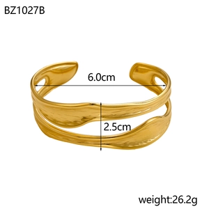 Modern gold plated stainless steel open bangle with fluid irregular geometric design