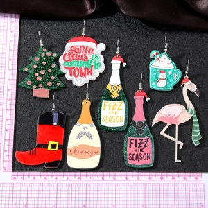 Festive Christmas acrylic earrings set featuring Santa, snowman and flamingo motifs