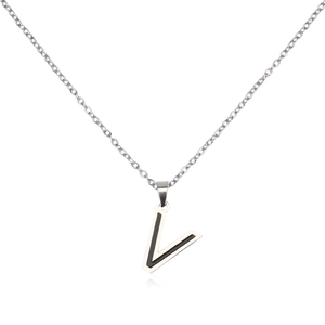 Macro detail of a silver stainless steel necklace featuring a two-tone letter V pendant