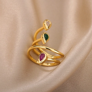 Minimalist gold spiral ring with three colorful teardrop-shaped zircon gemstones