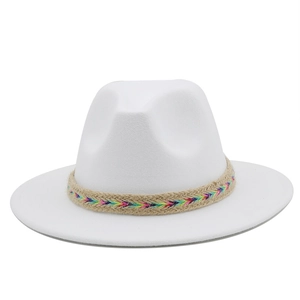 Close-up of white wool fedora hat featuring a colorful geometric embroidered band decoration