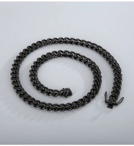 Detailed view of black polished stainless steel Cuban link chain with a secure lobster clasp