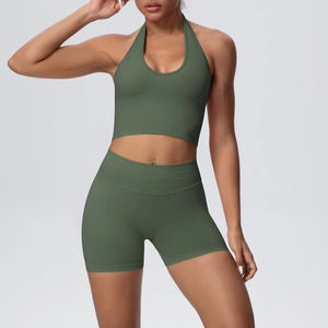 Detailed texture of olive green ribbed fabric on seamless yoga bra and high waist shorts