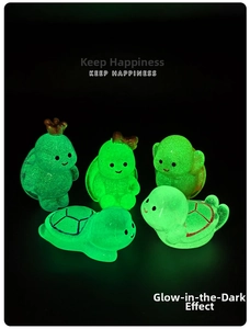 Luminous turtle figurines set in glowing green resin showing various cute mini poses