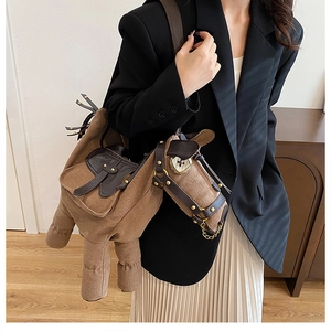 Brown horse-shaped canvas shoulder bag with PU leather saddle and metal chain details