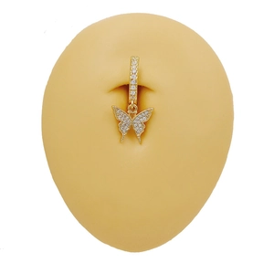 Elegant gold butterfly navel ring with white zircons shown on skin model for piercing