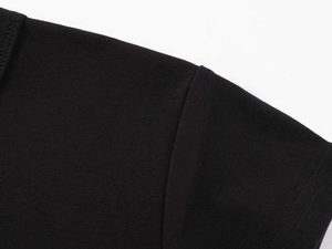 Close-up of shoulder seam and knit texture on a black modal fitted sports t-shirt