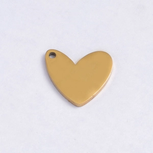 Close-up of heart-shaped polished gold stainless steel pendant for jewelry DIY
