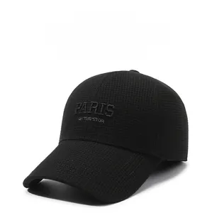 Detailed view of the thick fabric and PARIS embroidery on a black winter baseball cap