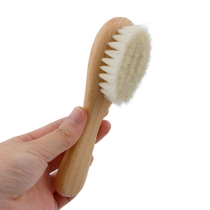 Natural beechwood baby hairbrush with soft wool bristles for scalp massage and grooming