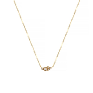 Detail of gold plated stainless steel necklace with asymmetric white zircon cluster pendant