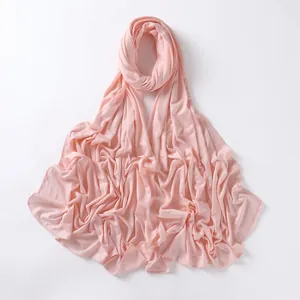 Detail of light pink jersey modal scarf showing soft fabric texture and fine stitched edges
