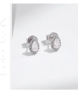 Detail view of pear-cut moissanite earrings with halo diamonds in S925 sterling silver