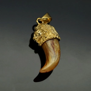 Detailed close-up of a golden lion head pendant with a resin wolf fang, retro hip-hop style