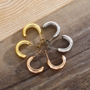 Three pairs of polished C-shaped stainless steel hoop earrings in gold silver and rose gold
