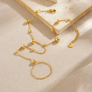 Bracciale anello in acciaio inossidabile dorato con perline tonde e nappe lunghe
