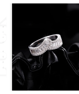 Macro detail of overlapping S925 silver ring with baguette and round cubic zirconia