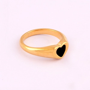 Close-up of 18K gold-plated stainless steel ring featuring a black epoxy heart design