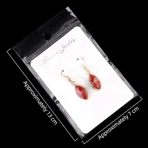 Marquise cut purple amethyst gemstone drop earrings with gold hooks on display card