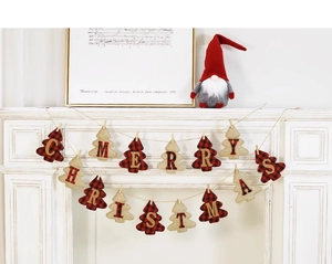Close-up of burlap and buffalo plaid Christmas tree banner on a white mantel