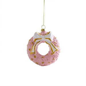 Pink Christmas wreath ornament with white gold-lined bow and gold string on white background