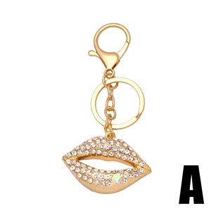 Porte-clés lèvres étincelantes en alliage doré avec pendentif en strass pour sac à main