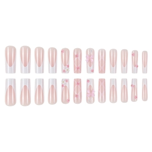 Pink and white long coffin press-on nails with 3D floral, pearl, and bow decorations