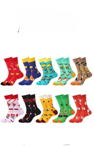 Flat lay of mid-calf cotton socks with colorful food patterns including pizza and sushi