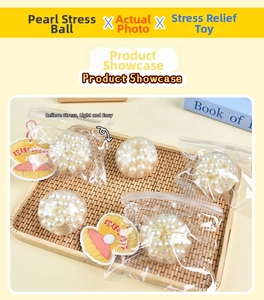 Close-up of pearl sensory stress ball in woven tray with shell tag and soft filling