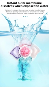 Close-up of heart-shaped multi-chamber laundry pod dissolving in splashing water