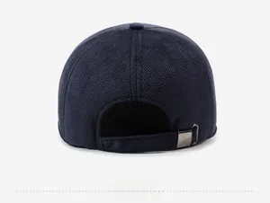 Rear view of winter baseball cap showing herringbone texture and metal buckle