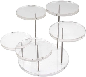 Detailed view of clear acrylic tiered jewelry display stand with sturdy metal supports