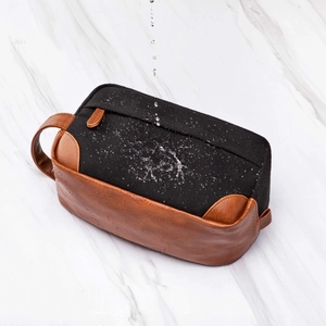 Detailed close-up showing a vintage waterproof canvas and PU leather toiletry bag for men.