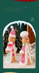Detailed knit texture of standing gingerbread dolls with sequins and festive scarves