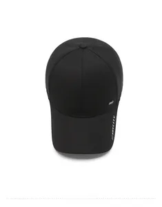 Close-up of black twill baseball cap showing metal logo and white ARNVE SEV text detail