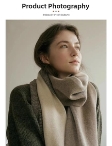 Detailed close-up of soft knit scarf featuring cream and brown houndstooth texture
