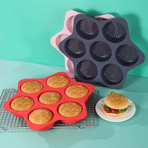 Macro detail of 7-cavity star-shaped silicone hamburger bun mold with breathable holes
