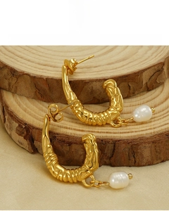 Detail of 18K gold U-shaped textured earrings with pearl pendants, lead and nickel free