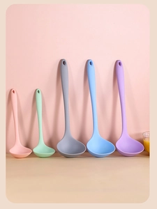 Five assorted heat-resistant silicone soup ladles in pastel colors shown in a row