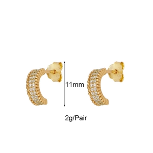 Detail of 11mm gold geometric hoop earrings with zircon pavé setting and 2g weight