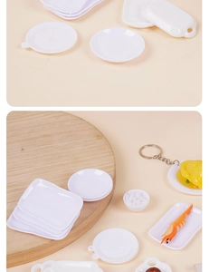Detailed close-up of miniature plastic plates and tiny food models for dollhouse DIY