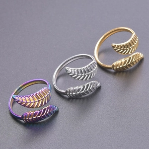 Three-color comparison of feather-shaped adjustable open rings in gold, silver, and rainbow