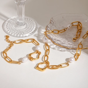 Baroque pearl and gold chain necklace with bracelet set in minimalist luxury style
