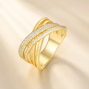 Macro view of gold-plated S925 silver Moissanite cross pavé stacked X-ring design