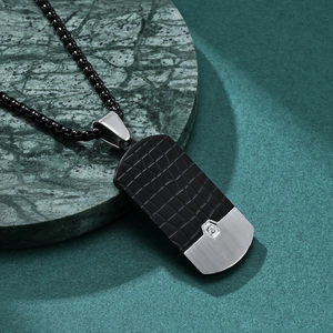 Men's necklace with black crocodile texture pendant and silver base on green marble stone