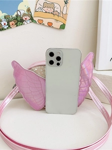 Pink sequin crossbody bag with angel wings and laser finish shown with phone for size