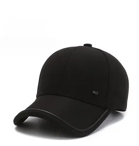 Detail shot of black cotton baseball cap with NLS metal logo and refined side stitching