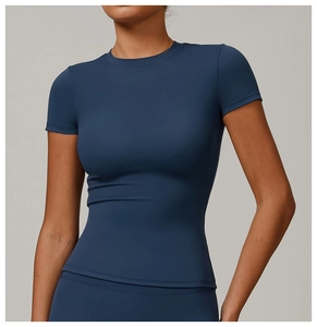 Detail of navy blue slim fit yoga shirt featuring quick-dry fabric and crew neck design