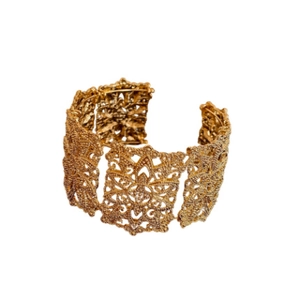Retro gold hollow lace pattern wide cuff bracelet with a vintage minimalist open design
